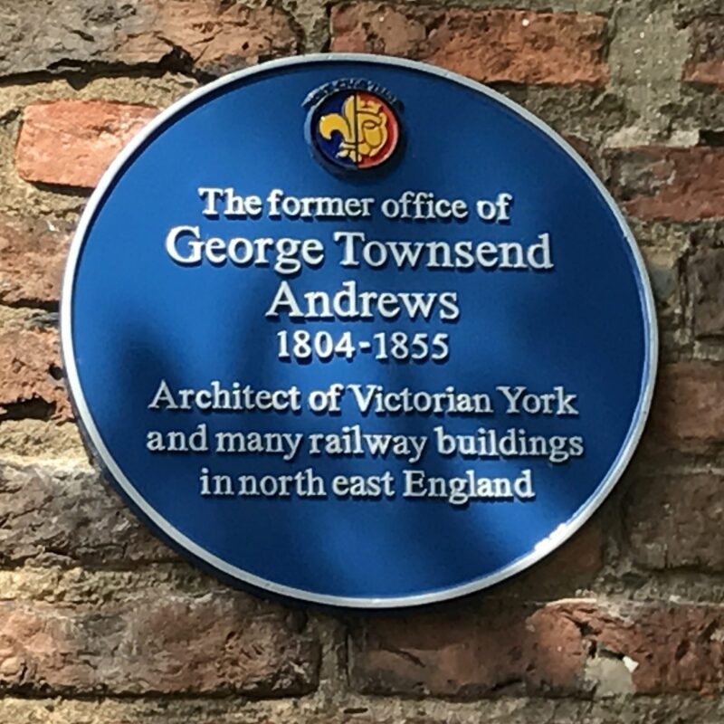 Blue plaque commemorating the former office of George Townsend Andrews